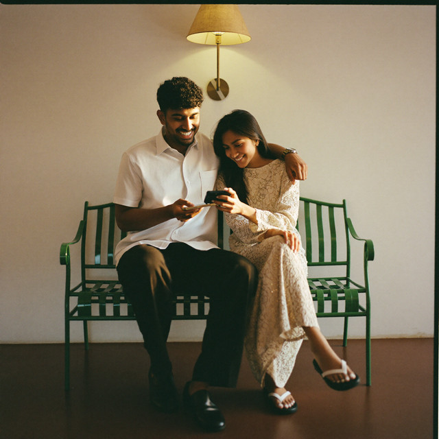 Two friends sharing a phone